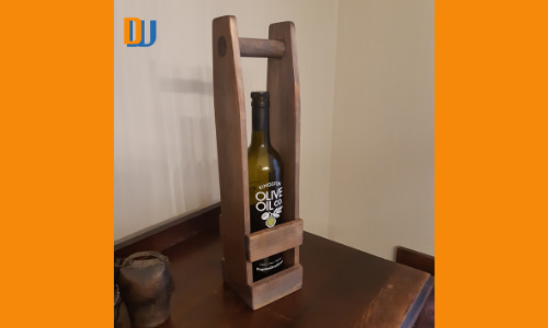 Wood wine bottle carrier finished with weathered board and protected with Linseed oil