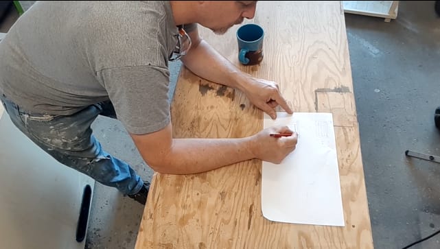 Picture of Paul sketching the coffee table